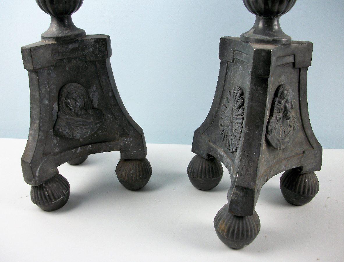 a pair of pewter candlesticks